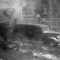 Photograph of Minneapolis firefighters trying to move a Hennepin County Morgue truck after being iced in during a January 3, 1940 fire at the Marlborough Apartment Hotel