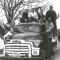 Black and white photograph of NFO farmers and creamery employees ride a bulk truck out to milk dumping site on the Martin Lampi farm near Annandale on March 7, 1963.