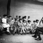 Black and white photograph of a man telling a story to residents of the Jewish Sheltering Home for Children in Minneapolis, c.1925.