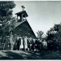 Group outside the reconstructed Lac qui Parle Mission