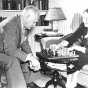 Black and white photograph of Maud Hart Lovelace and husband Delos playing chess, c.1945.	