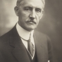 Black and white photograph of Clarence Johnston, ca. 1919. 