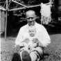 Black and white photograph of Delos Lovelace with his daughter, Merion, c.1931.