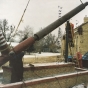 Color image of the world’s largest peace pipe, photographed during installation next to the Rock Island Depot in Pipestone, 1998. 