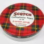 photograph of a red plaid scotch tape container