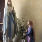 Color image of Sculptures of the Virgin Mary (at left) and Saint Bernadette (Bernadette Soubirous, at right). Interior of Our Lady of Lourdes Church, 27 Prince Street, Minneapolis, 2017. Photograph by Courtney Gregar.  