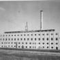 Black and white photograph of an exterior view of the American Crystal Sugar factory in Chaska. Date and photographer unknown.