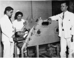 Iron lung patient and staff, Sister Kenny Institute, Minneapolis.