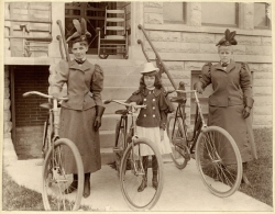 Two women and girl with bicycles