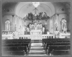 photograph of the altar and main aisle of St. Peter Claver Church