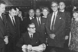 Governor Harold Levander signs the Minnesota State Act Against Discrimination