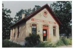 Photograph of the Ramsey District #28 School House after it was repurposed as the Ramsey Town Hall. Photographer unknown, ca. 1970s.