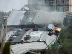 View of the collapsed I-35W bridge (Bridge 9340) on August 1, 2007. Photograph by Heather Munro.