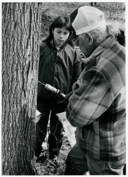 Maggie Sengoge and Porky White making maple sugar