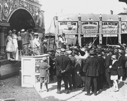 Black and white photograph of sideshows at the Minnesota State Fair, 1917.