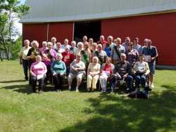 Color image of a Minnesota State Grange picnic held on the Sletton Farm in Aitkin on June 13, 2015.