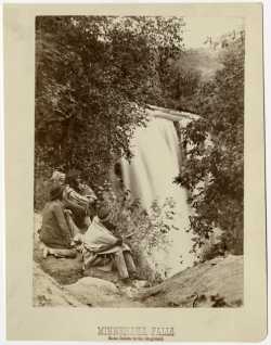 Black and white photograph of Minnehaha Falls, Dakota Indians in the foreground, 1857.