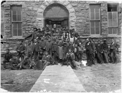 Children on the steps of the Indian School at Pipestone