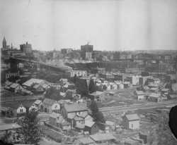 Black and white photograph of the West Side Flats and Wabasha Bridge, 1904.