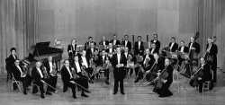 Black and white photograph of the St. Paul Chamber Orchestra on stage, ca. 1959.