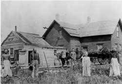 Polish immigrants in front of their farmhouse