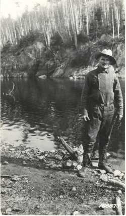 Black and white photograph of Count Rovigno at the foot of the White Iron Portage, Superior National Forest, 1922.