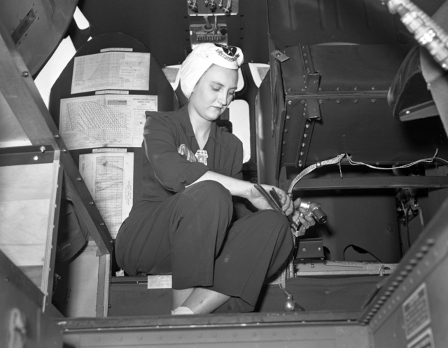 Woman working on the wiring of a B-24 "Liberator" bomber