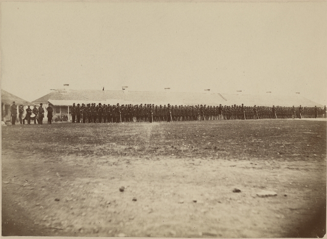 Second Minnesota Volunteer Infantry standing in front of the Long Barracks