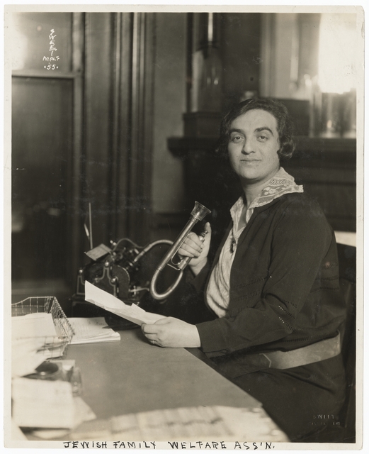 Black and white photograph of a woman in the office of the Jewish Family Welfare Association, Minneapolis, c.1925.