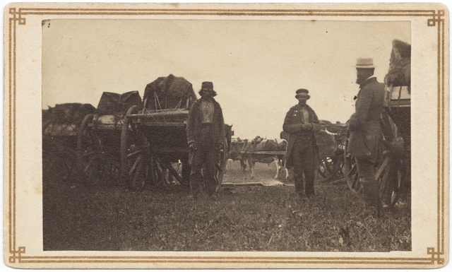 Black and white photograph of a camp with Red River carts, ca. 1860. 