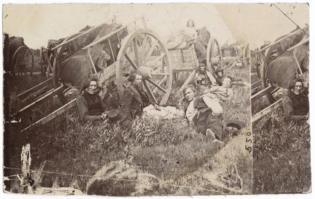 Black and white photograph of Métis drivers with Red River ox carts, probably in Minnesota, 1860.