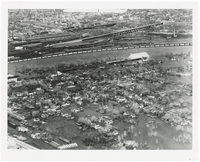 Black and white aerial view of West Side during flood, 1952.