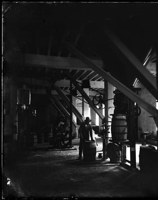 Workers sealing flour barrels inside Washburn A Mill, ca. 1875