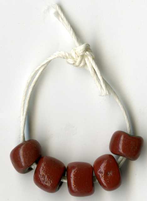 Color image of dark red trade beads. 