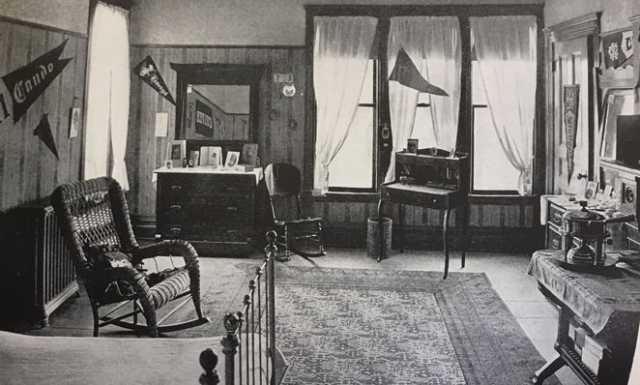 Black and white photograph of a student bedroom inside Graham Hall, 1912 or 1913.