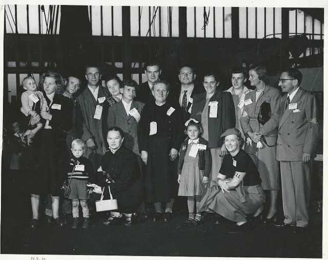 International Institute Committee welcoming refugees in New York Harbor, 1952