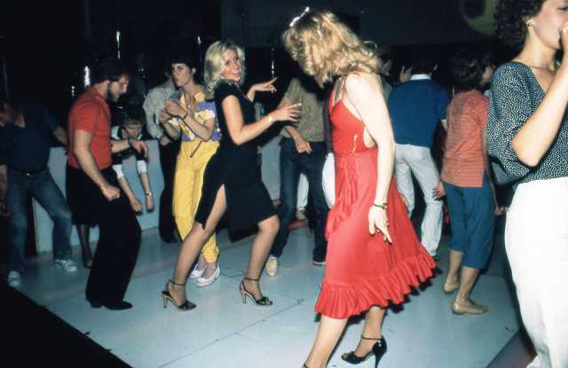 Color image of Disco dancers at Uncle Sam’s, ca. 1977. Photograph by Steven Laboe. 