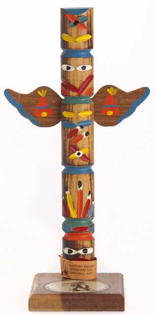 A souvenir totem pole, created ca. 1970, with a depiction of the Hamm’s bear. This piece is a good example of Hamm’s Brewing Company’s use of generic and often inaccurate Indigenous iconography in their advertising. Although this object was made by an Ojibwe family, totem-pole carving is not an Anishinaabe tradition; the art form is practiced by Indigenous groups on the West Coast of the United States and Canada, including the Haida, the Tlingit, and the Nuxalk.