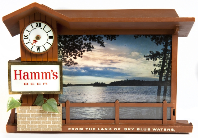 A promotional item produced by Hamm’s Brewing Company ca. 1950. This clock shows a cabin scene that embodies the essence of Hamm’s early advertising campaign around the “cool refreshment of Minnesota’s vacationland.”