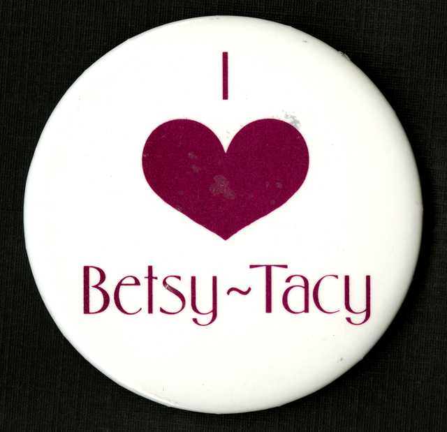 Color image of a "I love Betsy-Tacy" pinback button, manufacturer unknown, c.1990-1994.  