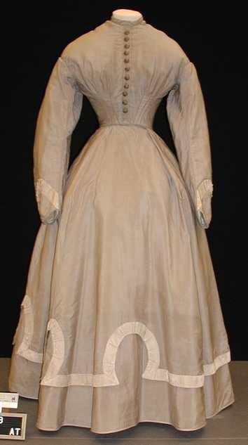 Color image of a wool wedding dress and jacket worn by Mary T. Hill, 1867.