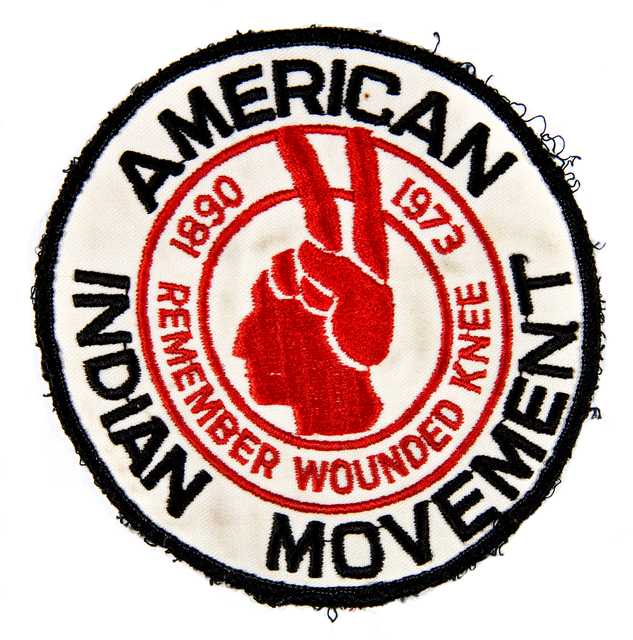 American Indian Movement (AIM) patch commemorating the eighty-third anniversary of the Wounded Knee massacre in South Dakota, 1973.