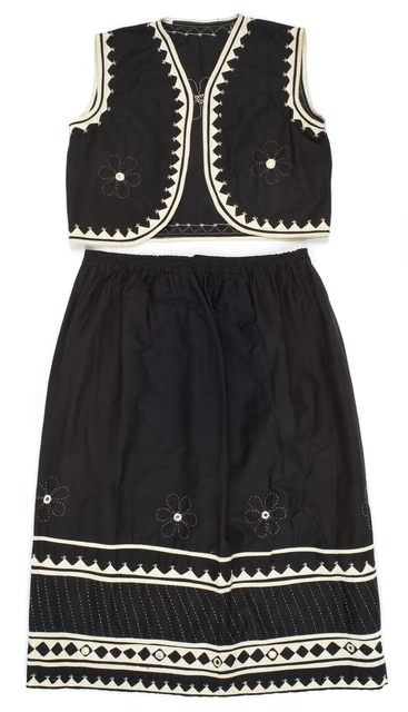 Color image of a child's black-and-white cotton vest and skirt made in India, 1967.