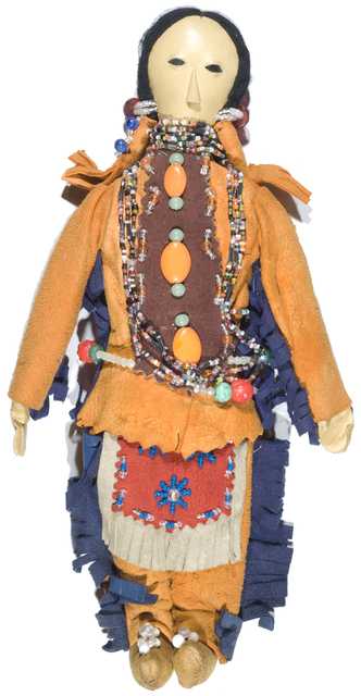 Color image of a Dakota doll made for "Bloom Bro. Co. Quality Line Souvenirs, Minneapolis" by the Bluecloud family from the Upper Sioux Indian Community in Granite Falls in the early 1900s. 