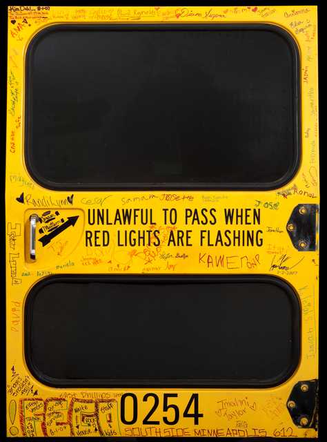 Emergency exit door from a school bus made by the Blue Bird Corporation of Fort Valley, Georgia, circa 2007. The school bus was transporting a group of day camp students when it was involved in the collapse of the I-35W bridge in Minneapolis on August 1, 2007. The door is signed by all of the children and adults who were on the bus at that time.