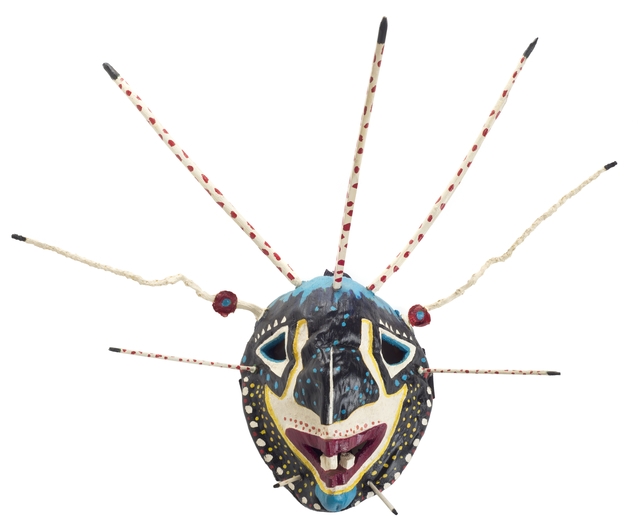 Color image of a carved coconut-shell vejigante mask made by Puerto Rican-Minnesotan artist and musician Ricardo Gómez c.1995.