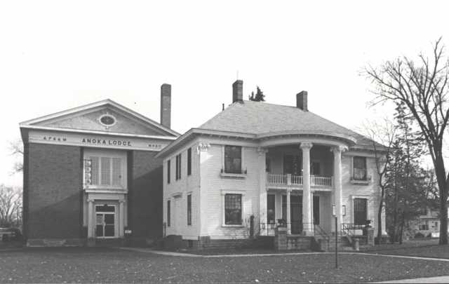Photograph showing Colonial Hall (right, built in 1904) after Masonic Lodge No. 30 (left, built in 1922) was built beside it. Photographer unknown, ca. 1970s. 