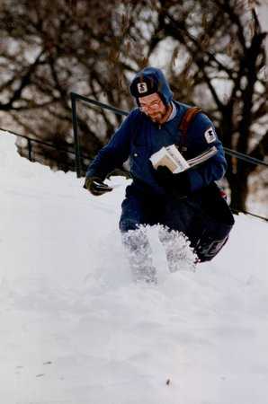 Color image of a mailman working after the Halloween Blizzard, 1991. Photograph by Stormi Greener, Minneapolis Star Tribune.