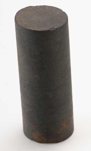 A piece of drill core used by E. J. Longyear near Mesabi station, ca. 1890. The piece measures approximately two and a half inches long and about one and an eighth inches in diameter.