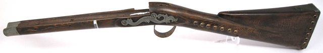 Color image of a musket stock used by the North West Fur Company. Made between 1790 and 1800.